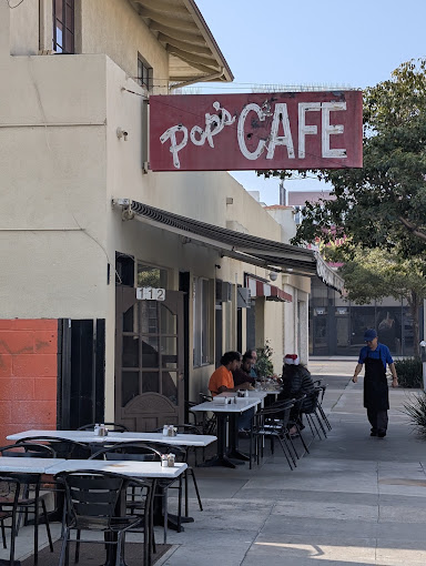 Pop's Cafe storefront and sidewalk seating on 9th St